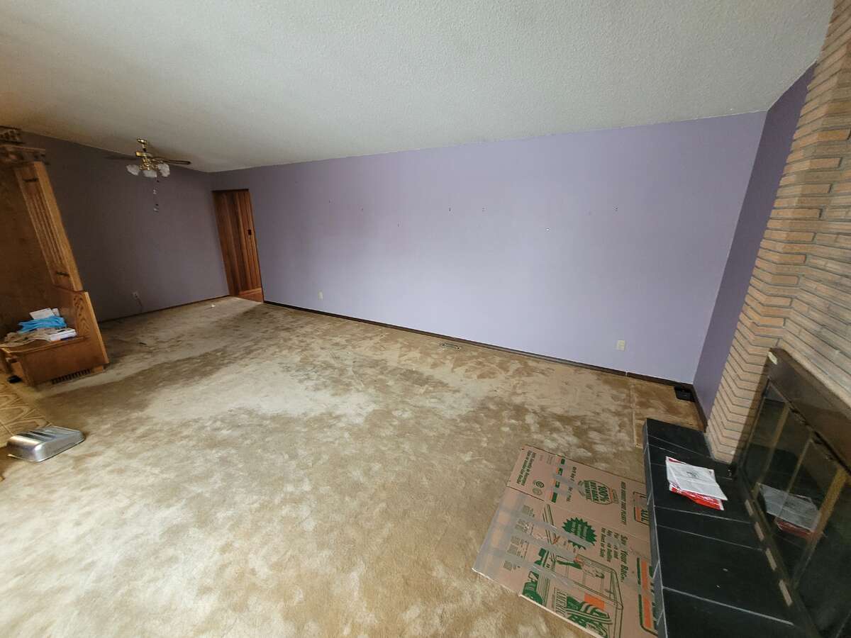 Living room with wood burning fireplace