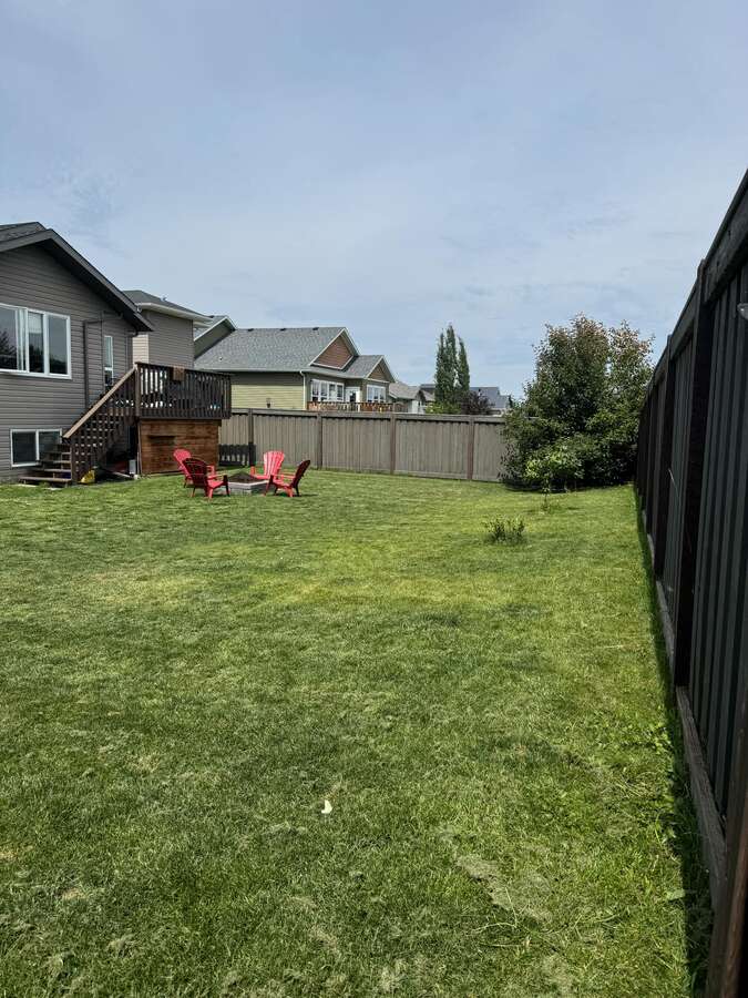 Backyard side of house mulched garden area