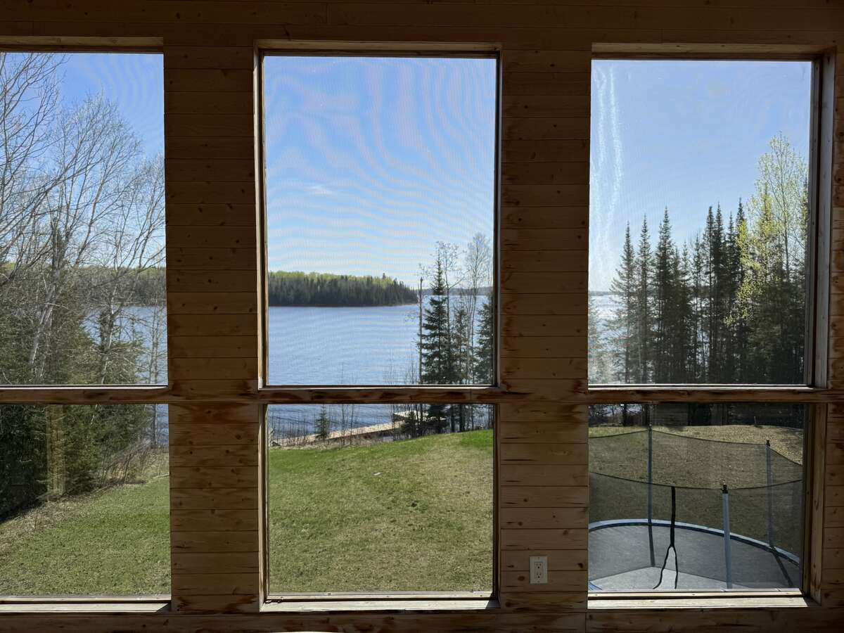 Pelican Lake views from the screened-in porch accessed from the dining room.