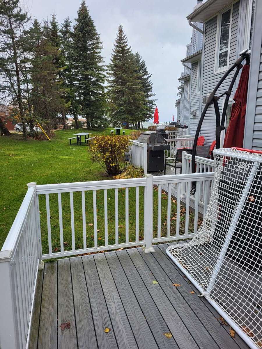 Back Composite Deck with Aluminum Railings Looking North to Water