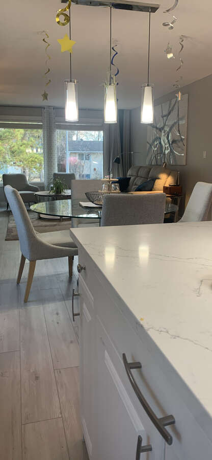 Open floorplan view from kitchen into the dining and living room