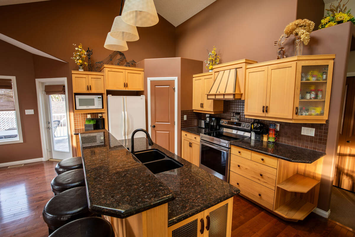 Bright dining area with access to raised deck and back yard
