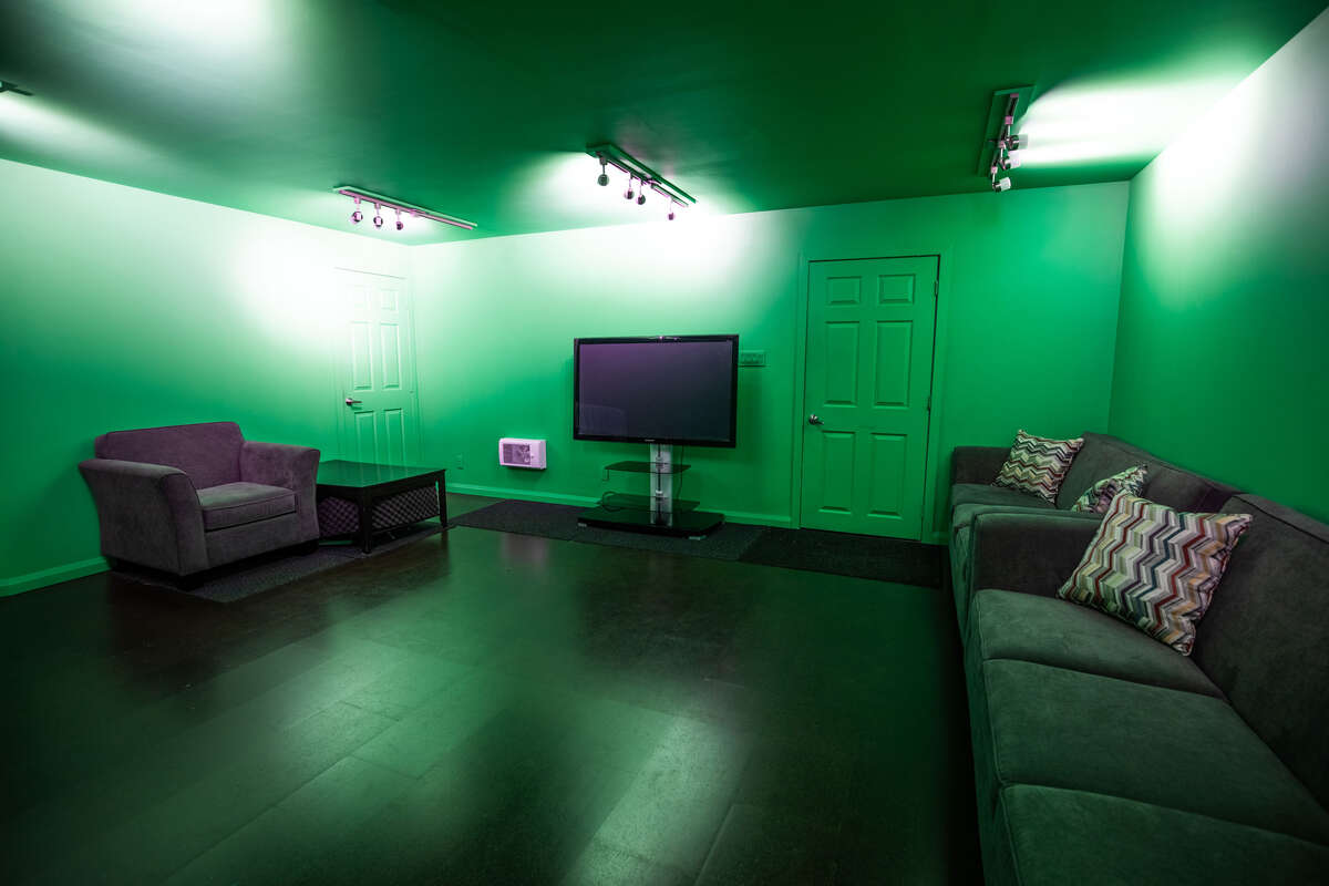 Opposite view of studio space, showing storage and entry doorways