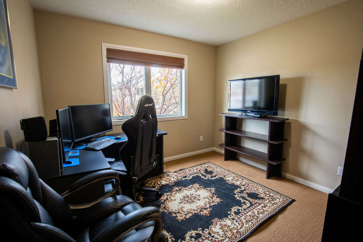 Bright main floor bedroom / office with walk-in closet / storage space