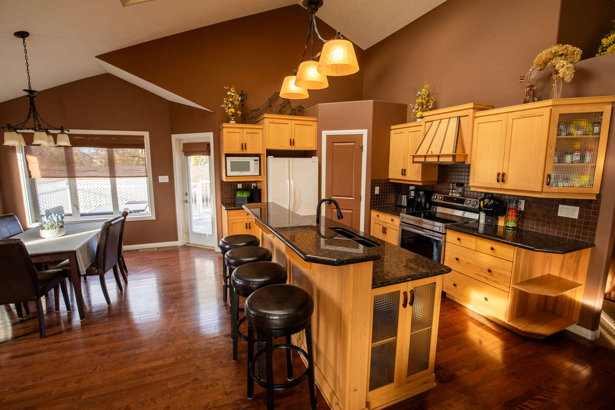 Bright dining area with access to raised deck and back yard