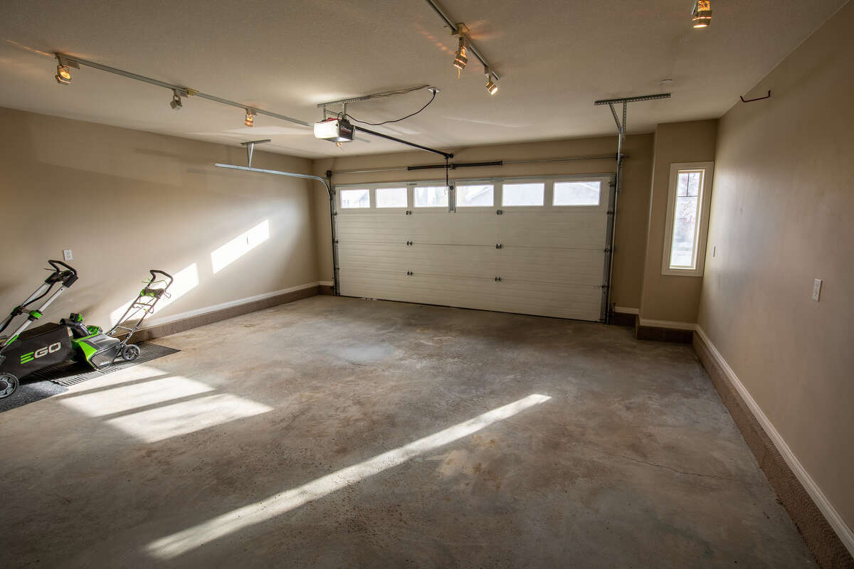 Fully finished, oversized double attached garage with roughed in natural gas for heating.