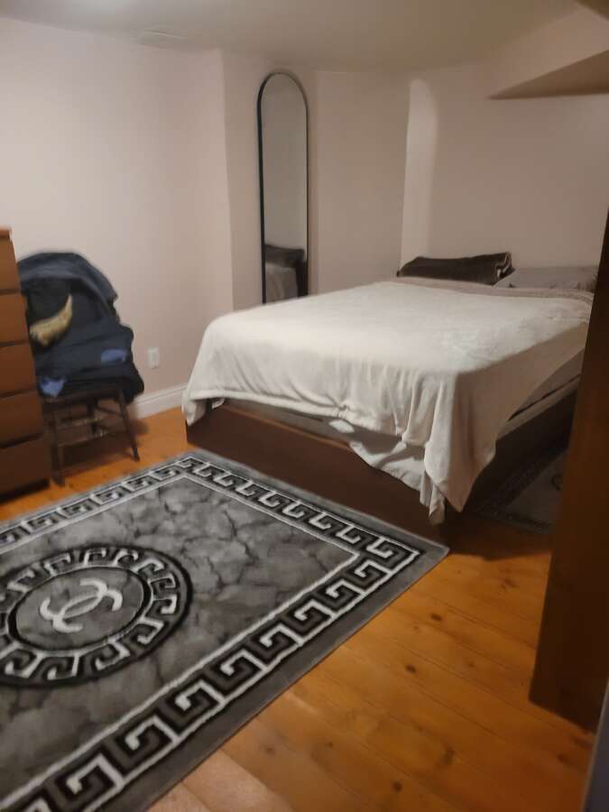 Apartment bedroom with furniture, queen bed, lots of room