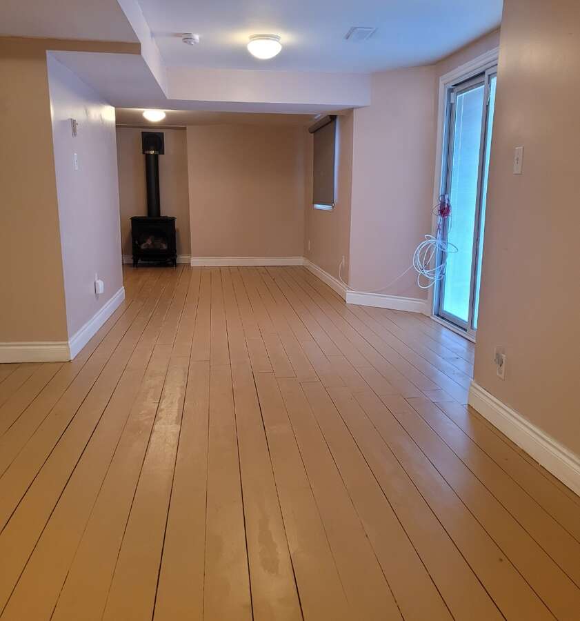 Basement unit living rm with gas fireplace,walk out to backyard, sliding glass doors