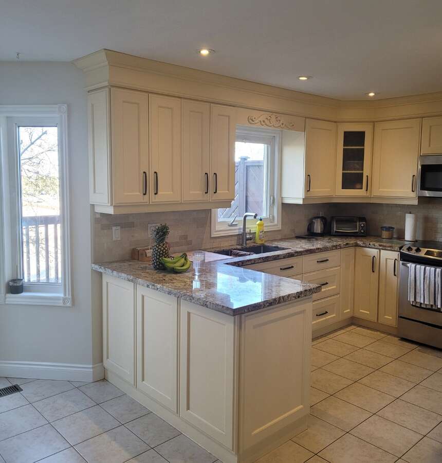 Kitchen view over looking deck, granite counters