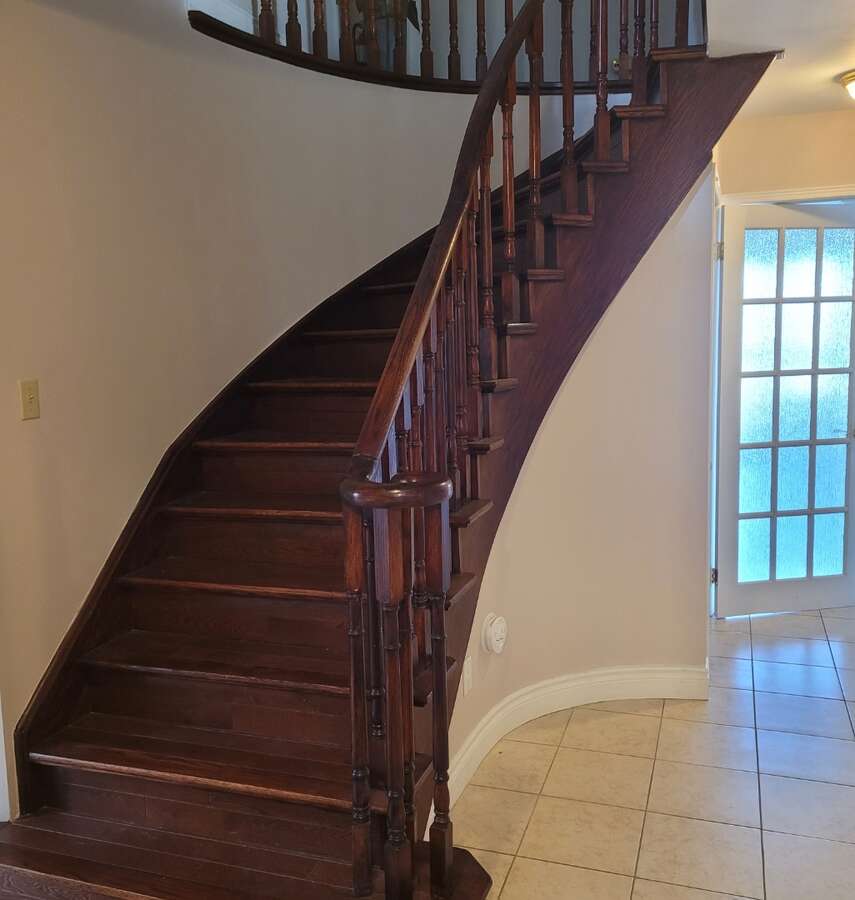 Front entry stairwell, french doors on all main floor