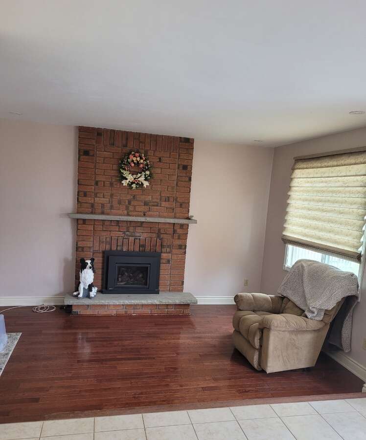 Family room with gas fireplace, hardwood floors