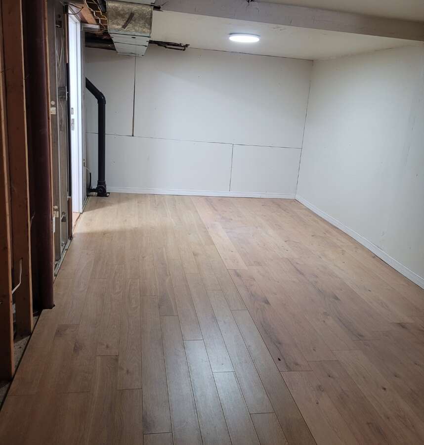 Storage or games room basement with gas furnace & HWT owned