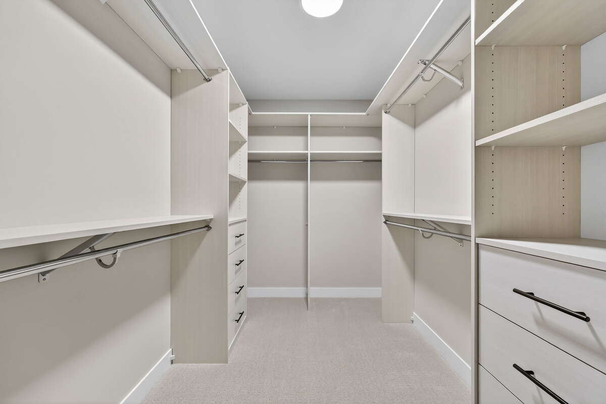 Primary walk in closet - Photos are of a similar model home, actual property may differ