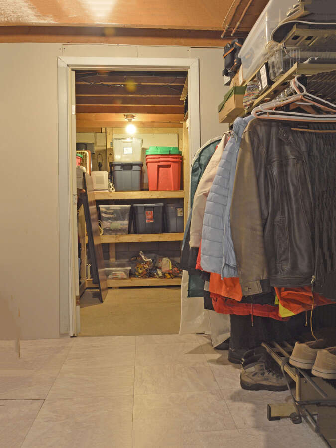 Off season clothing storage in the finished part of the storage space.