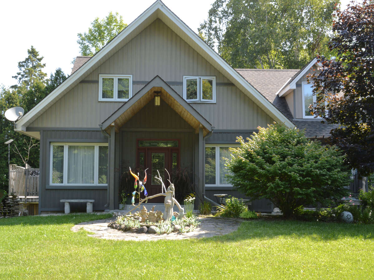 Welcoming Entry: A warm and inviting front door beckons you into this beautifully designed home.