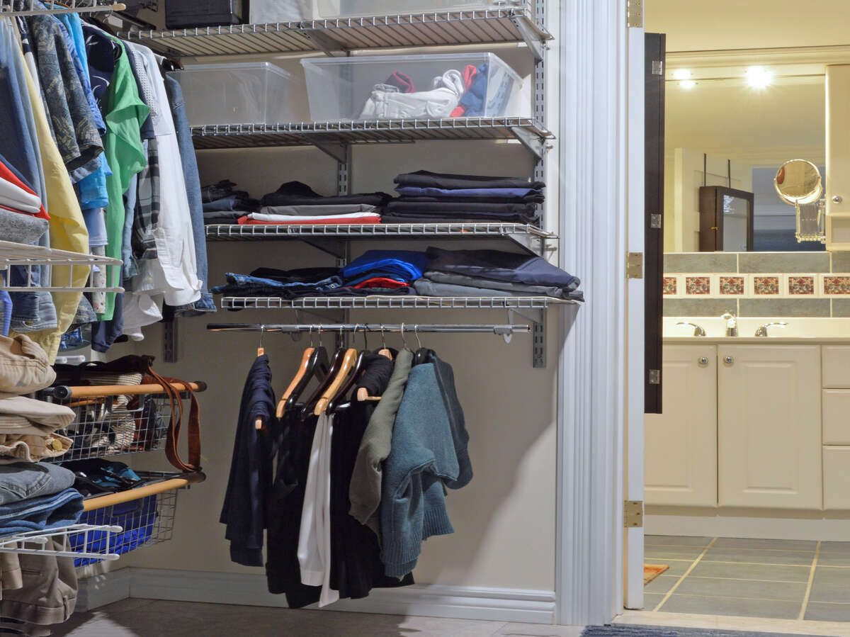 Walk-through closet connects the basement bedroom to a spacious bathroom, offering convenience.