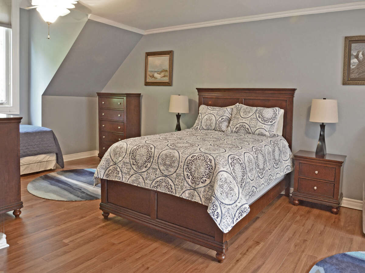 Bedroom 2: large enough for a sitting area and an extra single bed.