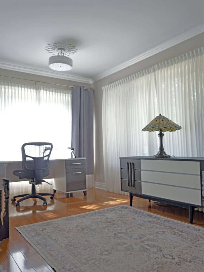 Airy main floor office, perfect for working from home. Designed for optimal virtual meetings.