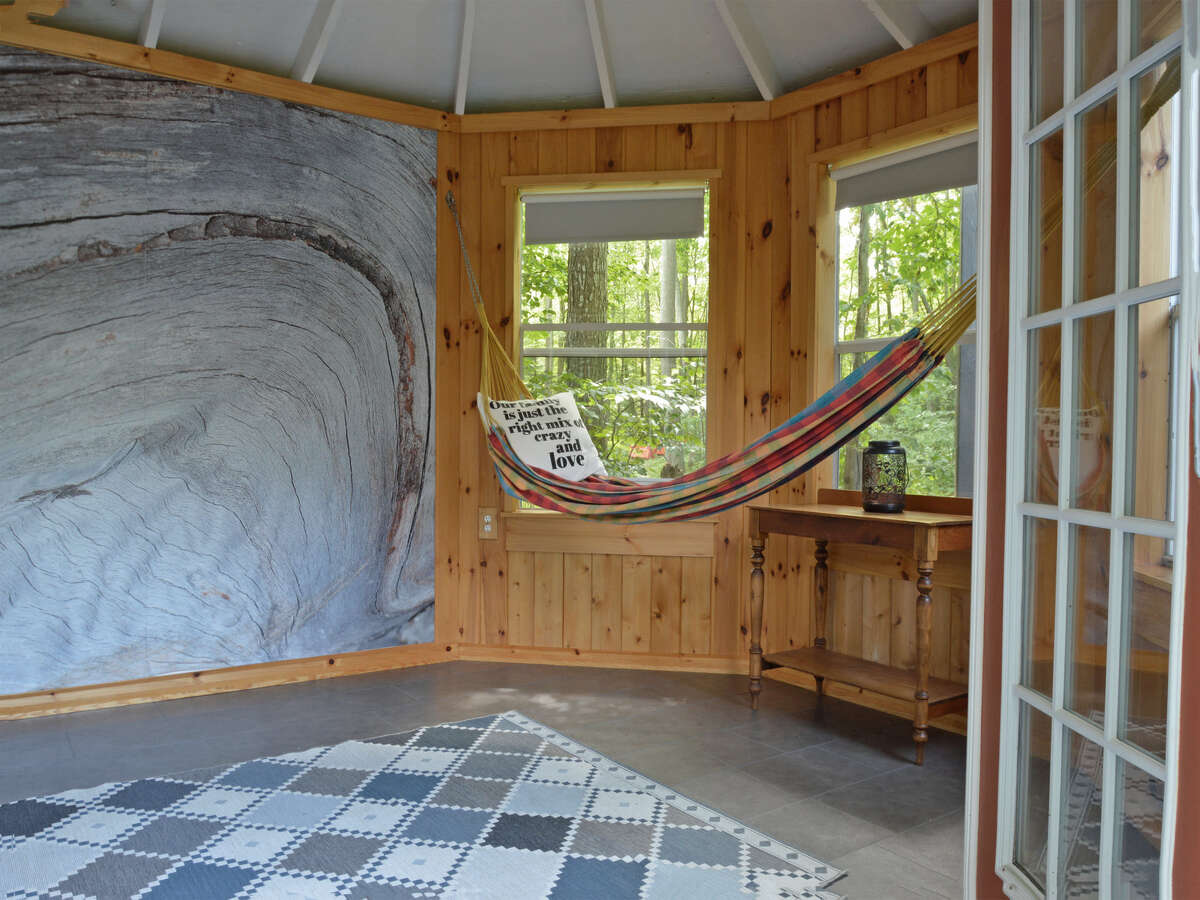 Inviting cabana interior with a hammocks, perfect for relaxing and unwinding in nature's embrace