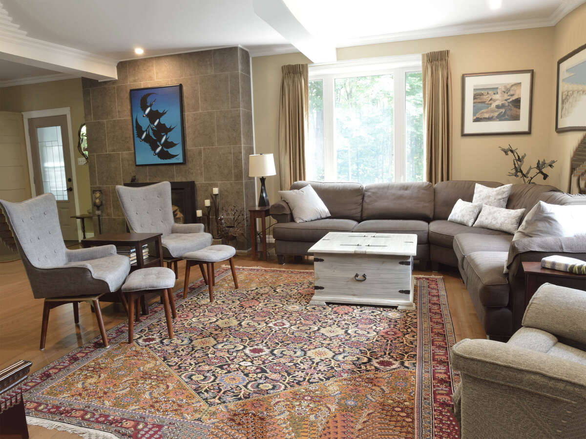 Spacious living room with a cozy fireplace, perfect for entertaining and family gatherings.
