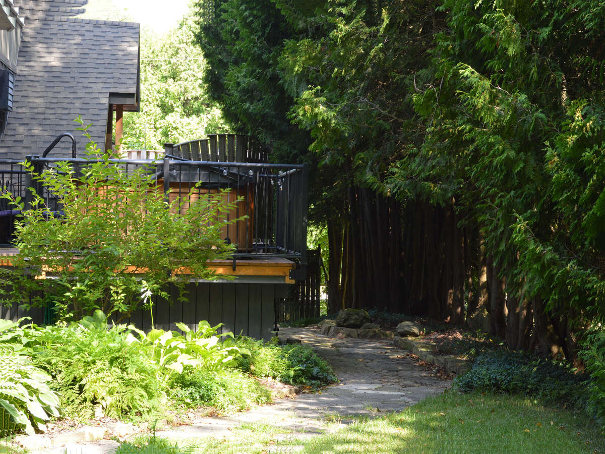 Lovely shaded walkway leading to the hot tub deck and the kitchen deck.