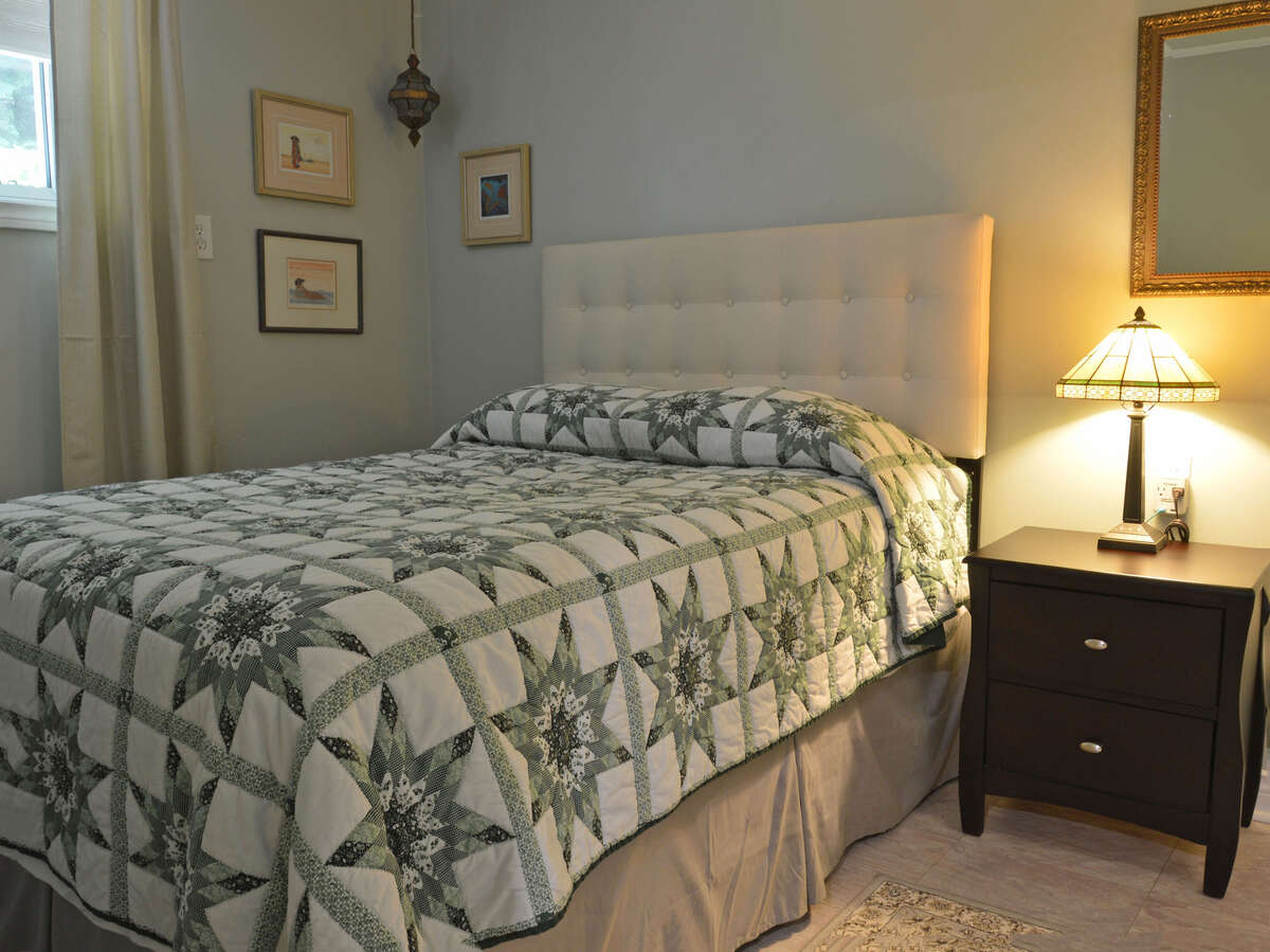 Cozy downstairs bedroom that could be perfect for a meditation space.