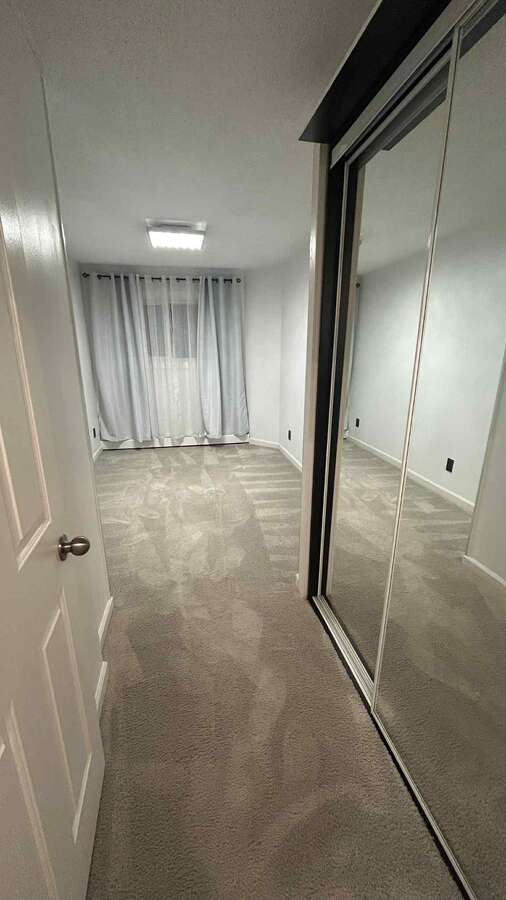 Second bedroom with a mirrored wardrobe ( sliding doors )