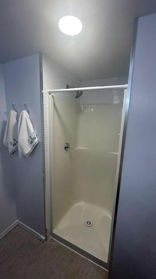 Ensuite bathroom with a shower