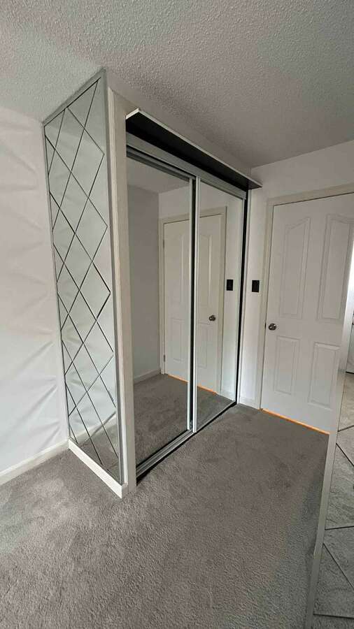 Second bedroom with a mirrored wardrobe ( sliding doors )