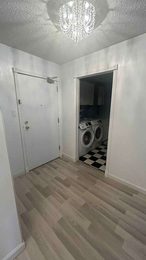 Hallway with a white glass wardrobe ( sliding doors )