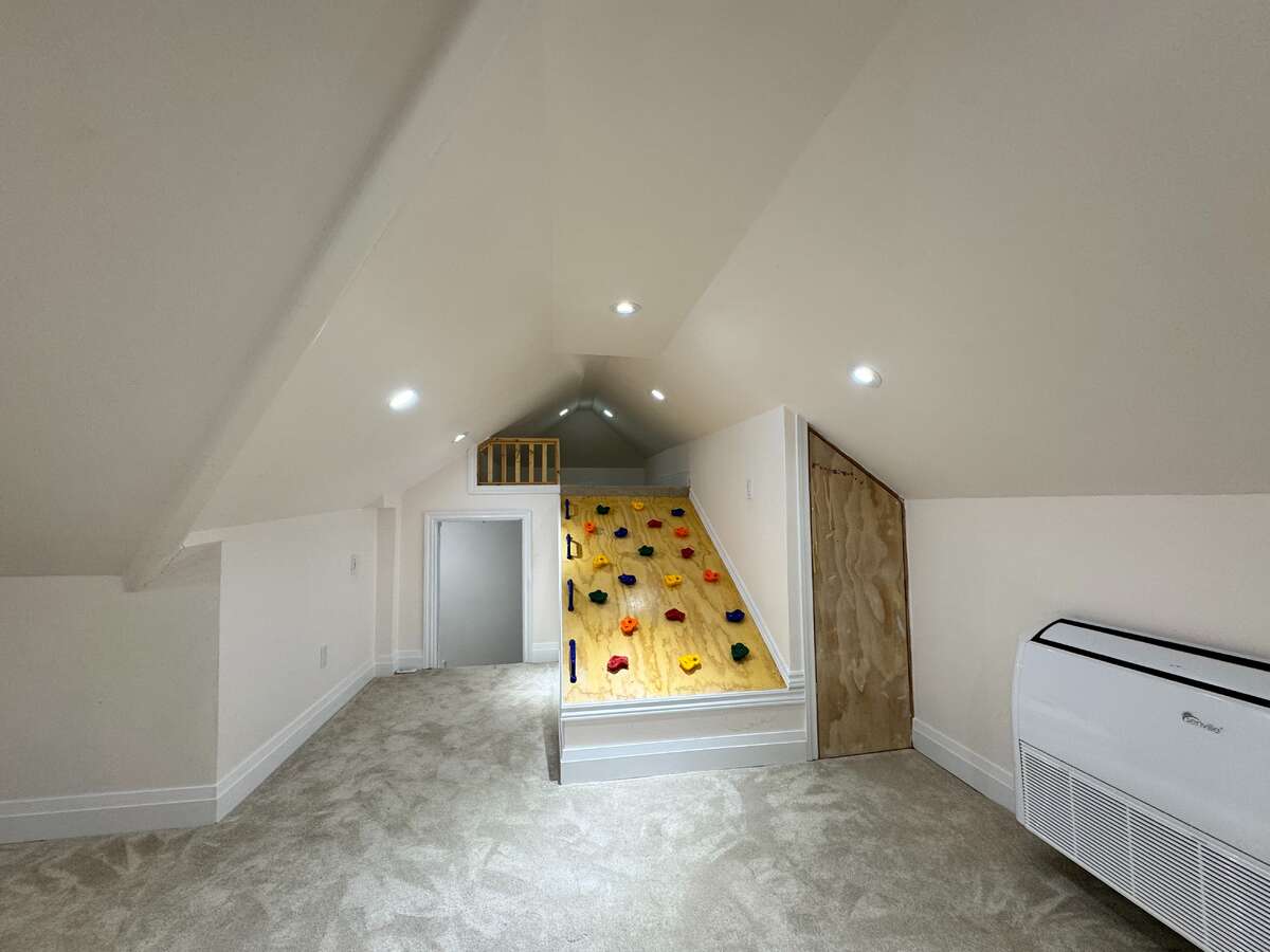 Finished Attic with Kids Climbing Wall to Upper Mini Loft