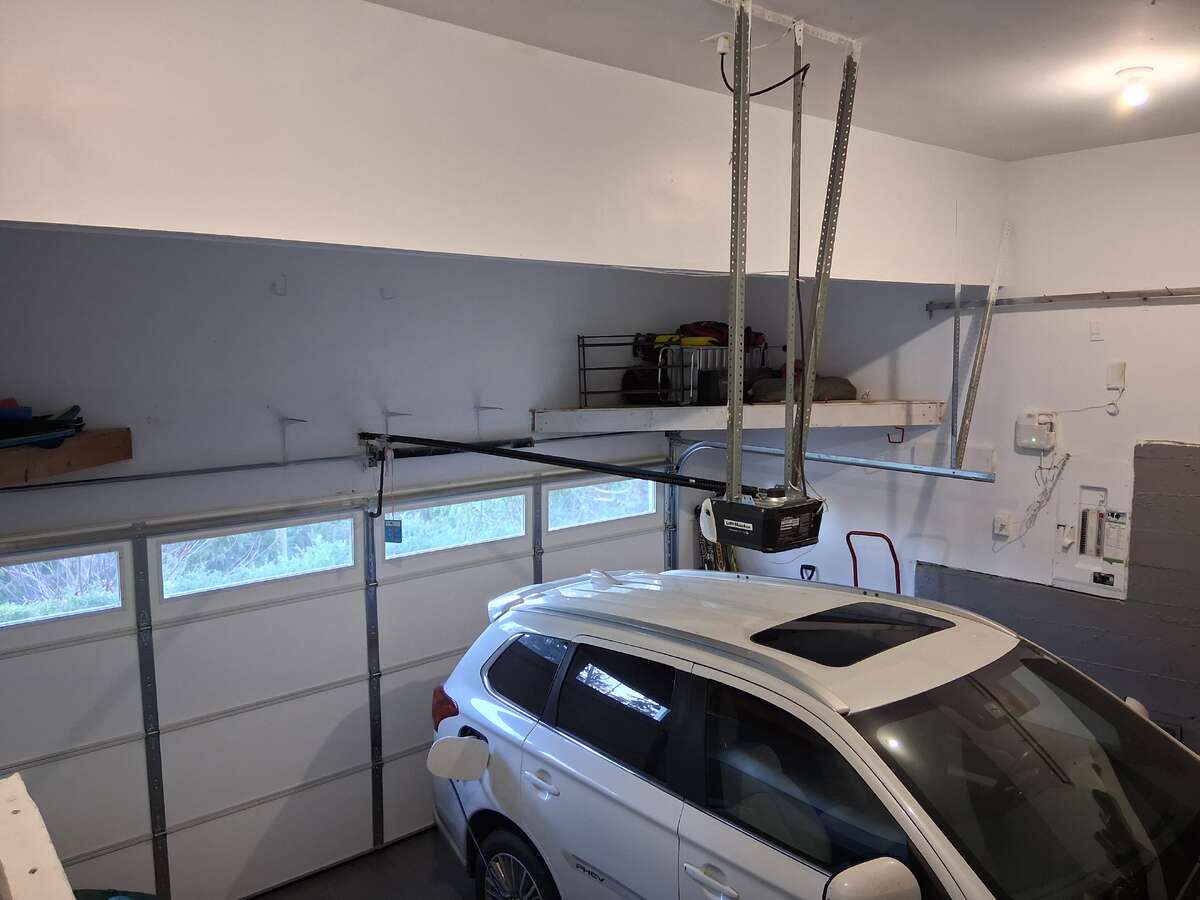 Big very clean Double Garage with High ceilings & Lots of storage & storage room