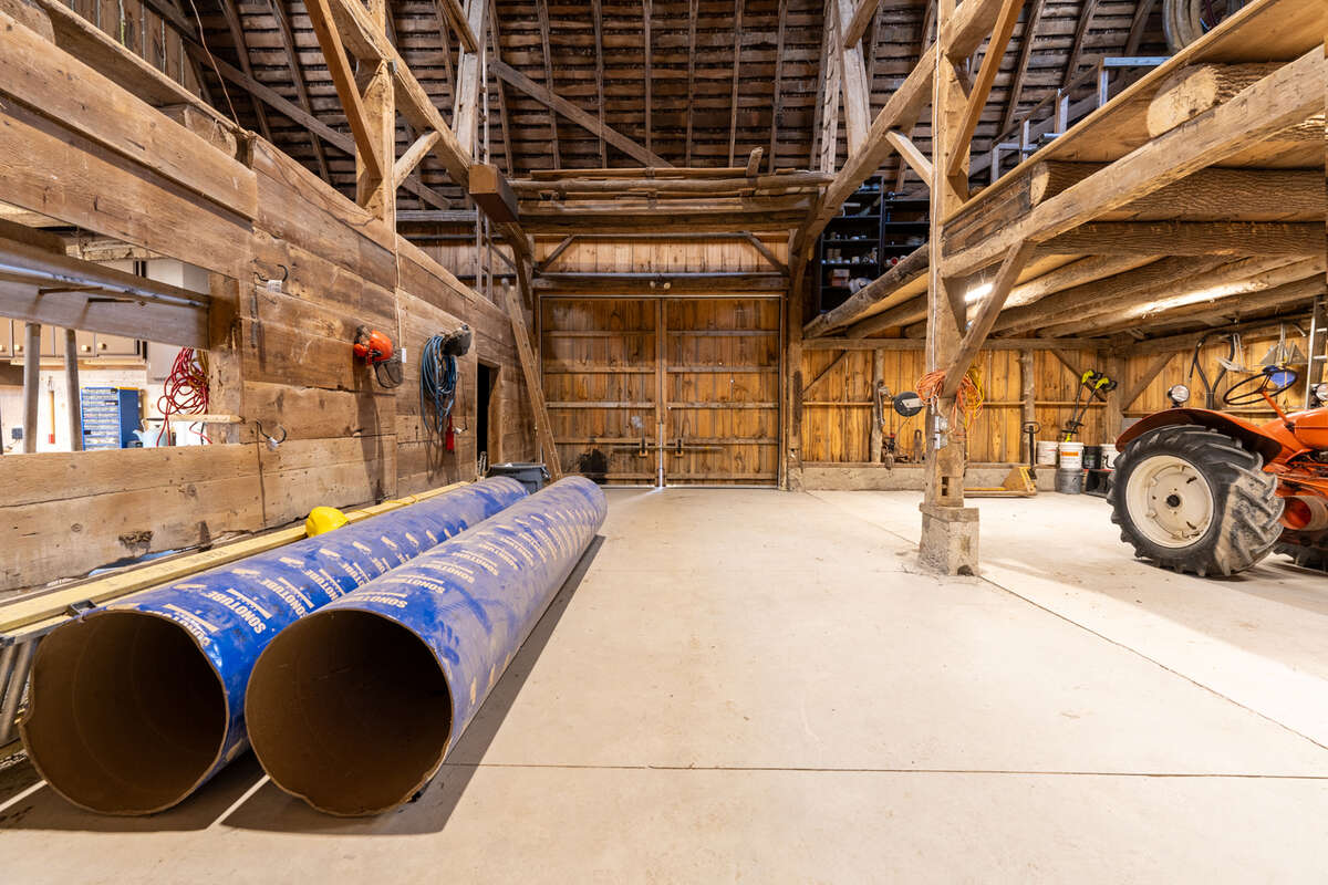 Timber-frame barn with loft on each side of the barn with a brand new RV Door and extension