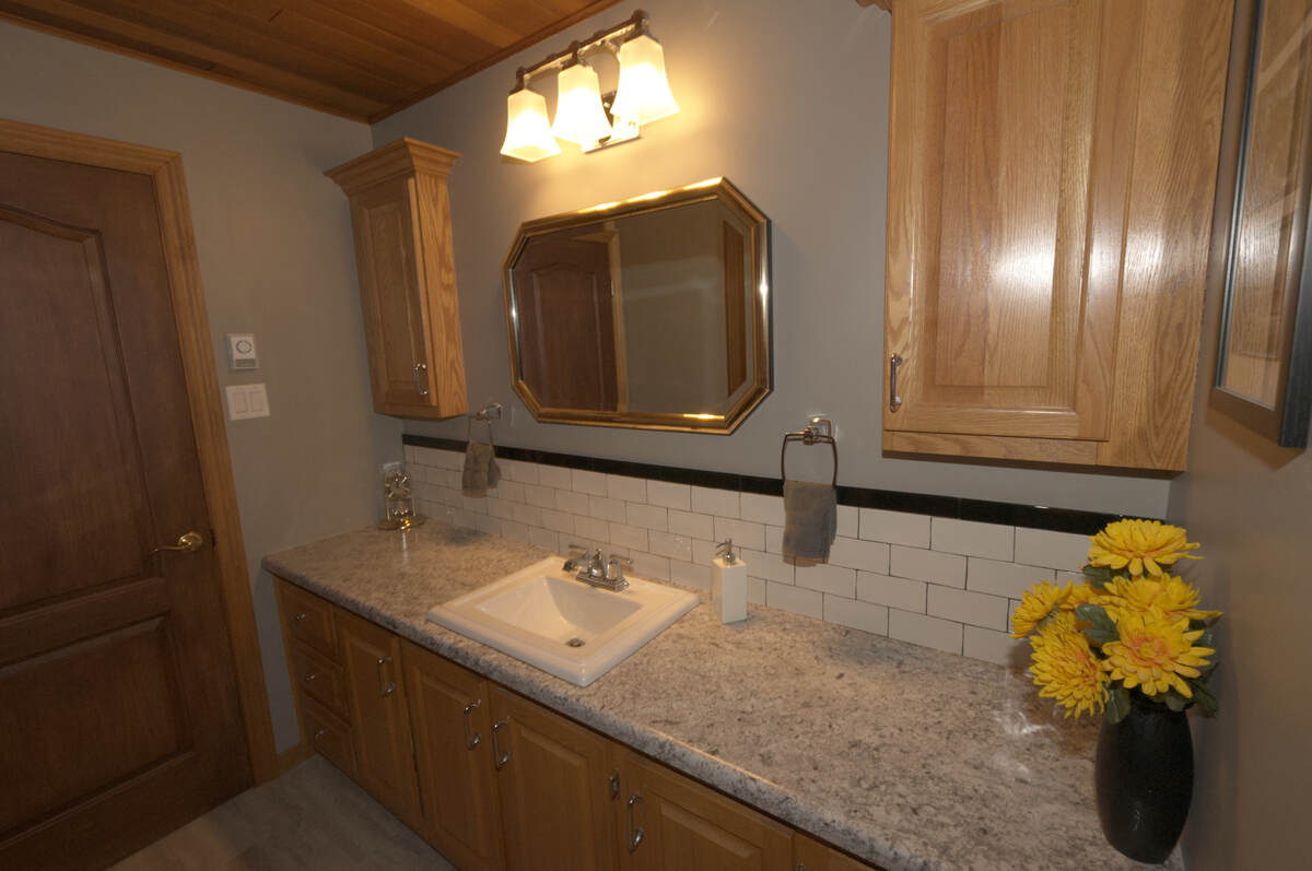 Main bathroom sink and storage