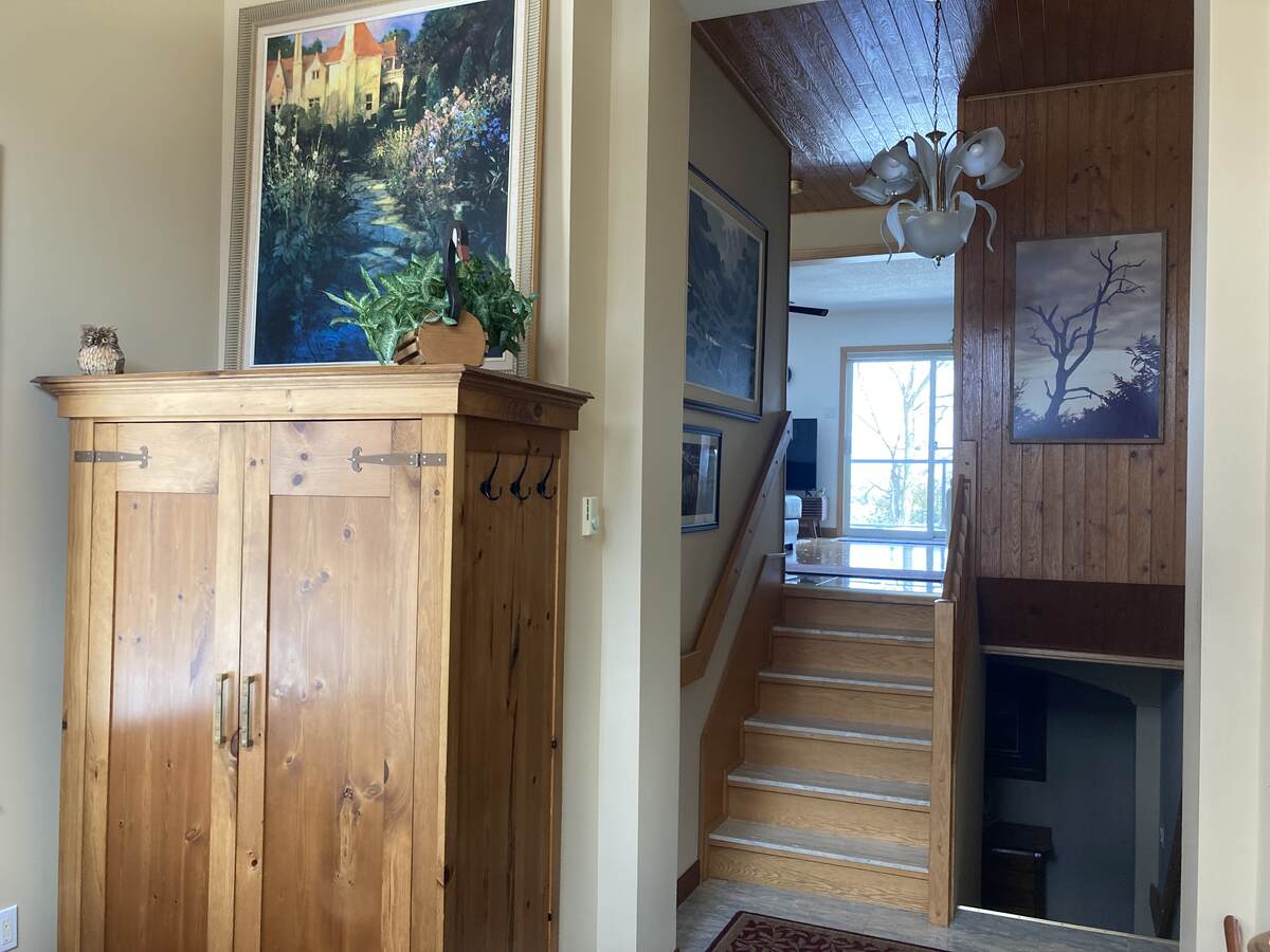 Looking up from foyer to main level