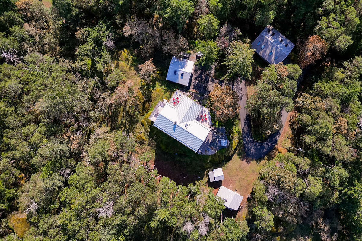 The house showing the decks and proximity of the outbuildings