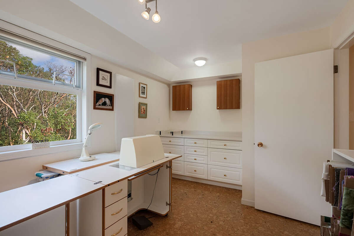 Flex room, currently used as a sewing room & winery - lots of drawers, a deep sink and ironing board