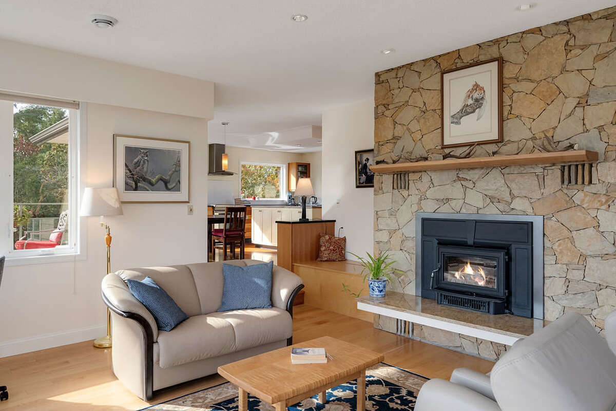 Living room with fireplace and western maple mantel