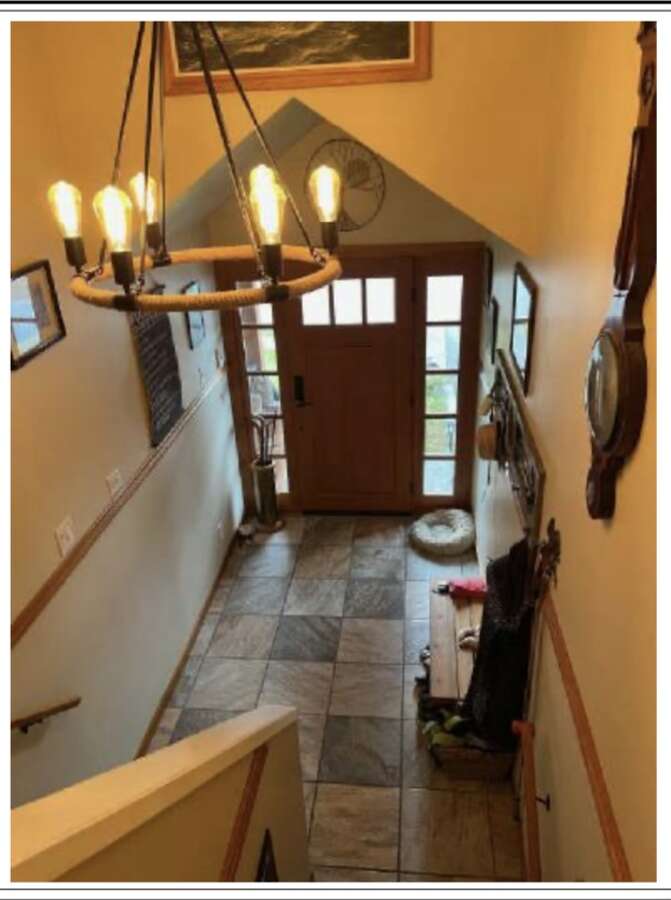 entrance from upstairs w/heated tile floor