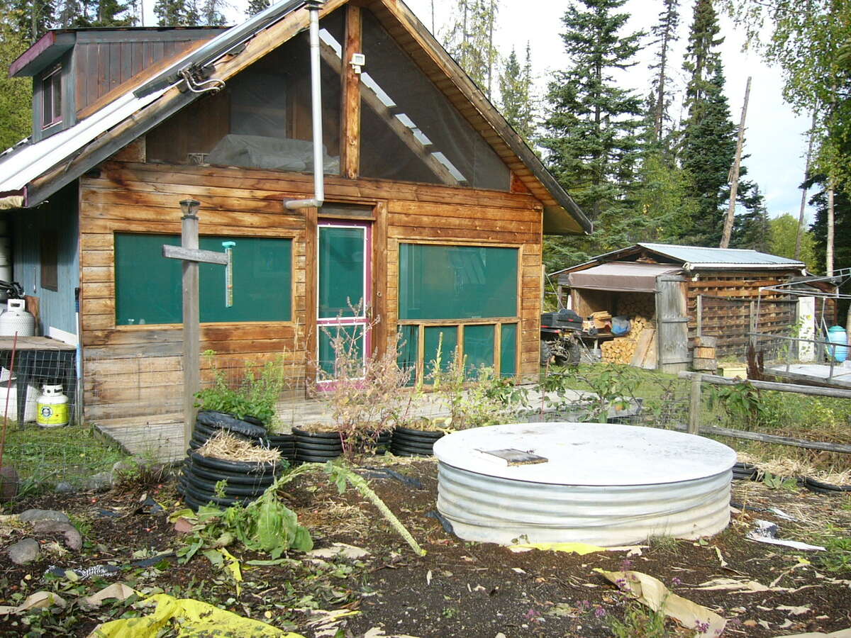 Screened in deck, sunner kitchen, cistern and fenced garden area.a.