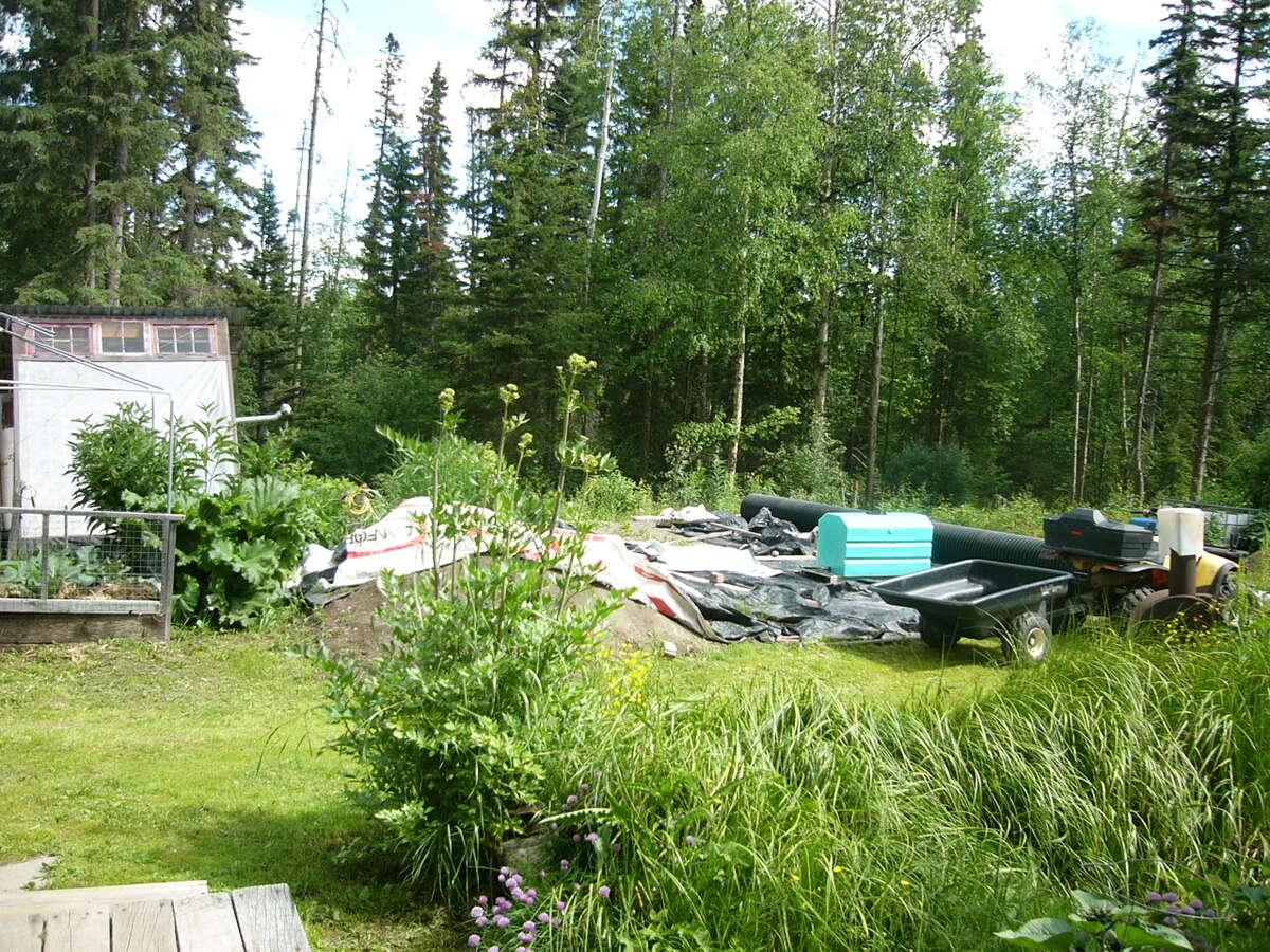 area has been built up and leveled for 14x32' greenhouse, woodstove to go with it.