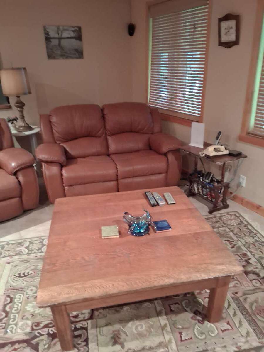 The downstairs finished room lets you watch tv and enjoy the warmth of the wood stove.
