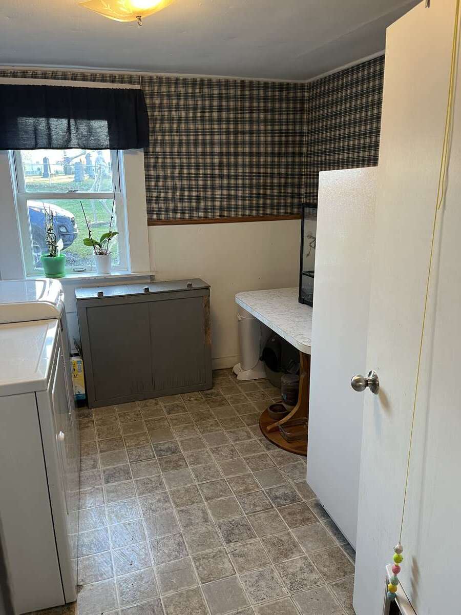 laundry room with stand up freezer