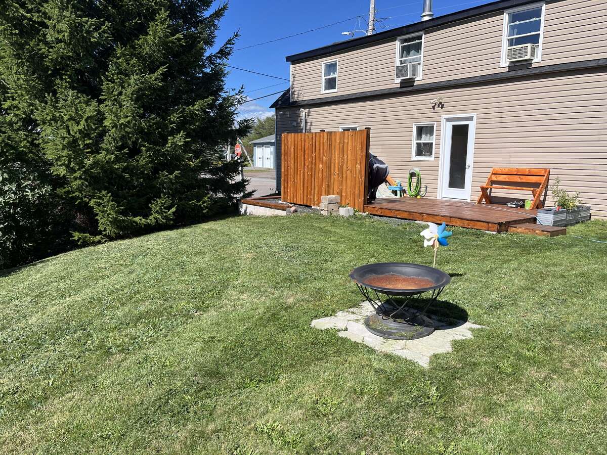 back of house with new deck