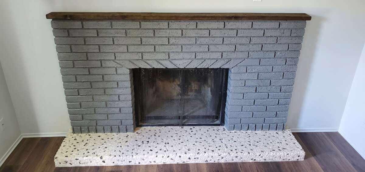 Woodburning fireplace with rivers tone hearth .