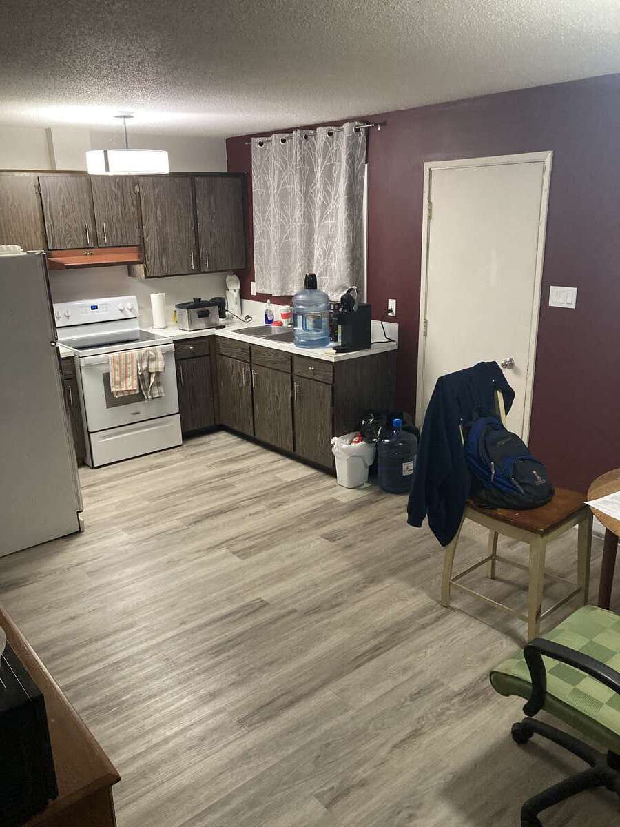 Kitchen with door leading to back yard