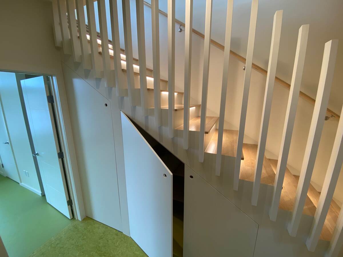 Stairs with under-stair laundry + storage.