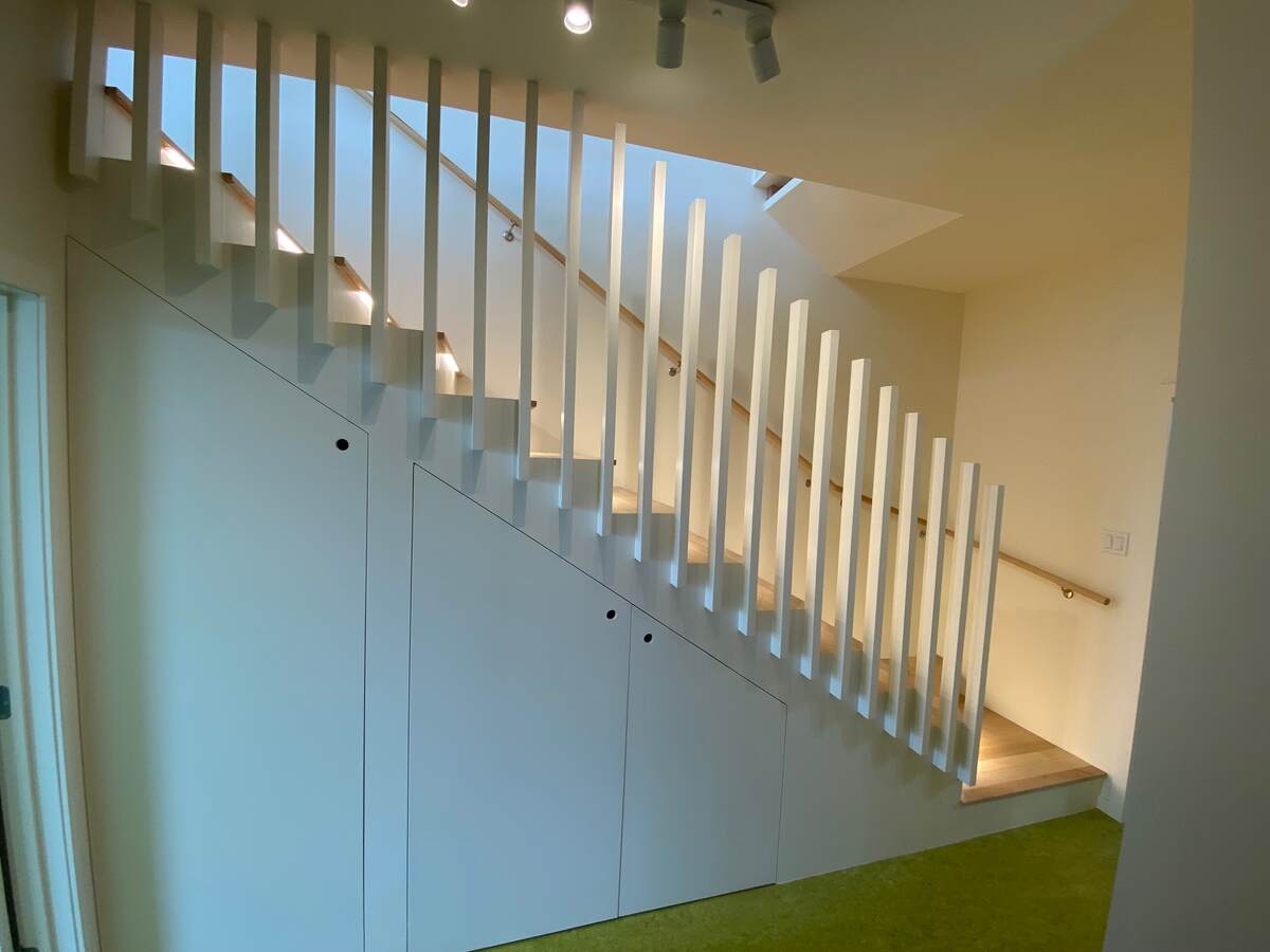 Stairs with under-stair laundry + storage.