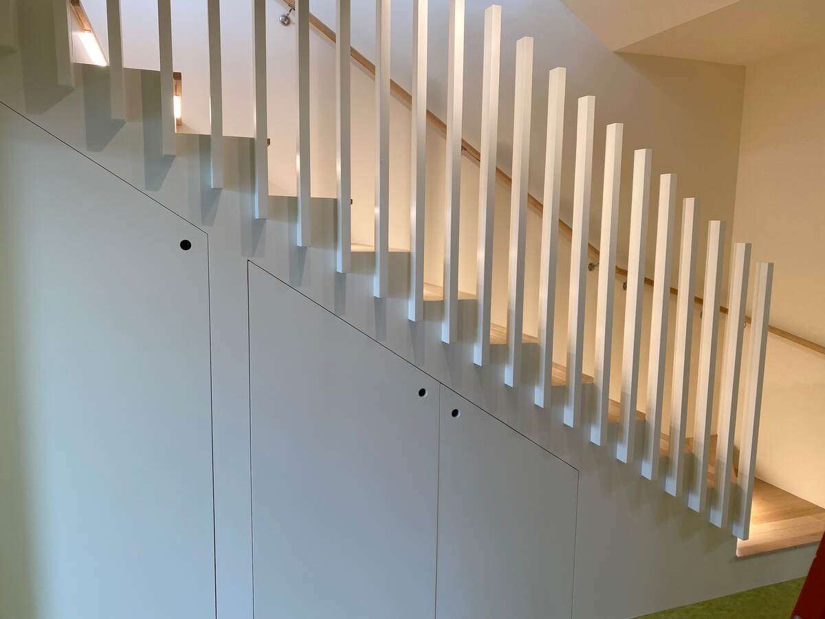 Stairs with under-stair laundry + storage.