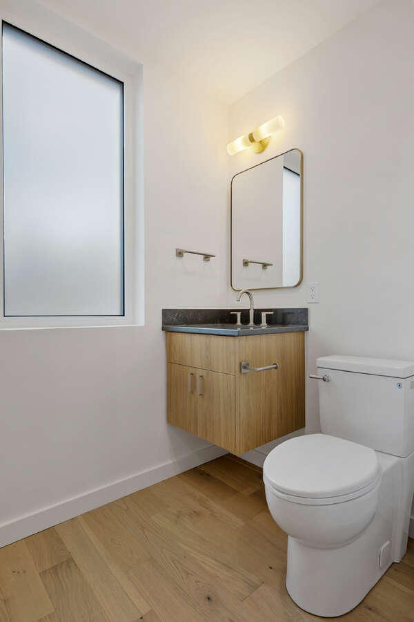 Own your own strata free townhome with backyard